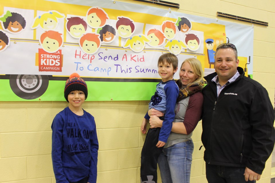 Futurescape Landscaping owner Ryan Lachance and his family helped "Fill the Bus" during the YMCA Strong Kids Charity Breakfast on March 22. Pictured left to right: Cowen, Carter, Selina and Ryan Lachance. (Heather Green-Oliver/Sudbury.com)