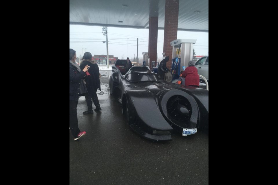Valerie Waugh posted these photos of “Batman” at the Lively Mac's on the What's Going on In Lively Facebook message board. “Even Batman needs gas,” she said. (Supplied)