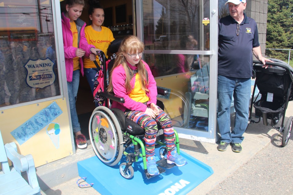 Katie Bellehumeur is now able to enjoy ice cream at Bitter Bill's Ice Cream Parlour in Val Caron thanks to a ramp installed there May 15 through the non-profit community group Access2all. (Heidi Ulrichsen/Sudbury.com)