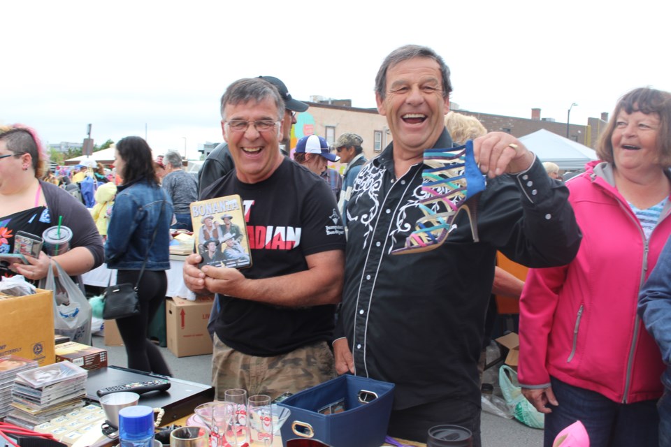 Blaise Boucher and Fernand Boucher hit the jackpot at the yard sale. (Sudbury.com/Gia Patil)