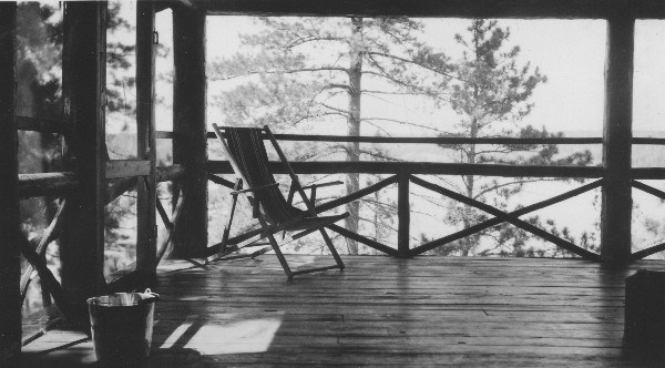 Screened porch on Charlton Lake, circa 1935. (Reproduction of a black and white silver gelatin photograph Rockwood Family Collection) 