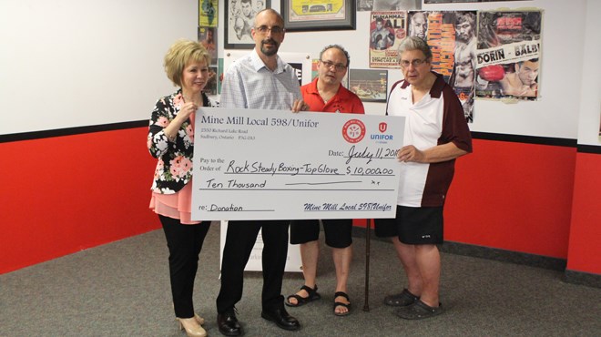 Top Glove Boxing Academy is officially home to Rock Steady Boxing in Sudbury thanks to a $10,000 donation from UNIFOR Mine Mill Local 598. (L to R) Estelle Joliat, Parkinson Canada, Marcel Charron, Local 598, Gord Apolloni, Top Glove, Chris Sheridan, Sudbury Sports Hall of Fame. (Matt Durnan/Sudbury.com)