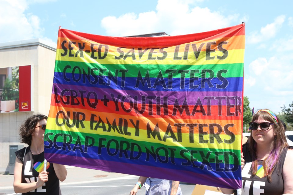 The new Ontario PC government's plans for the sex ed curriculum ere a focal point during Saturday's pride parade in Greater Sudbury, with many carrying signs to voice their opposition to the government's plans. (File)