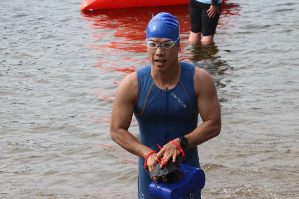 Eugine Woo, finishing his first lap of the SwimRun challenge. (Sudbury.com/Gia Patil)