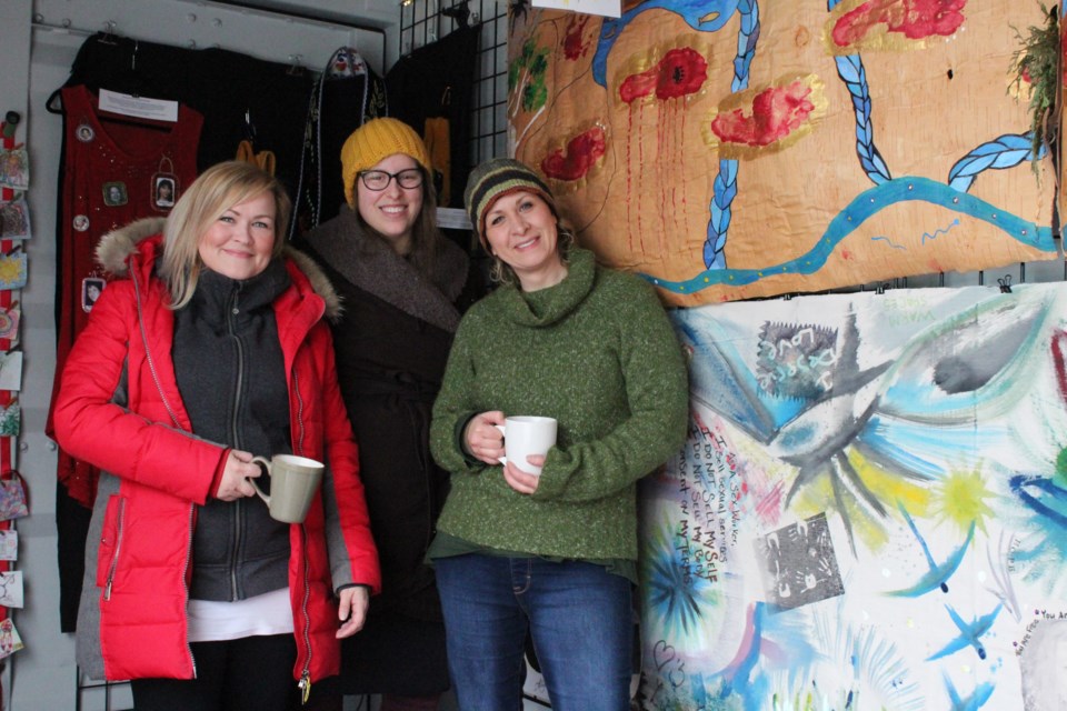 From left, Sarah Gartshore, director and playwright for project ArmHer; Cait Mitchell, facilitator and media artist for project ArmHer; and executive director of SWANS Tracy Gregory at Sexual Assault: The Roadshow on Sunday. (Keira Ferguson/ Sudbury.com)