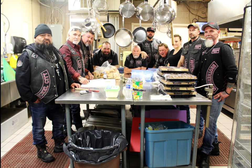 Warriors club members (left to right) Goddy Shawanda, Stan Killeen, Rheal Levesque, Alain Gareau, Vince Christie, Shawn Sutherland, Mike Mulvaney, James Letford and Jerry Lalonde brought desserts and laughter to suppertime at the Elgin Street Mission on November 28, 2018. (Allana McDougall/Sudbury.com)