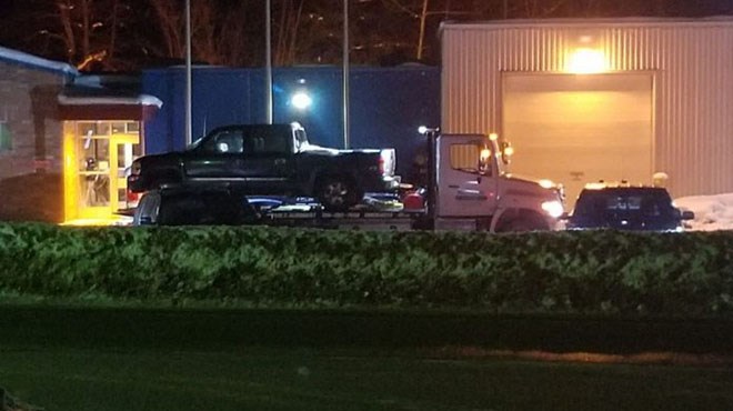 Suspect vehicle on tow truck at UCCM police station in M'Chigeeng, following Feb. 2 shooting (Manitoulin Expositor)