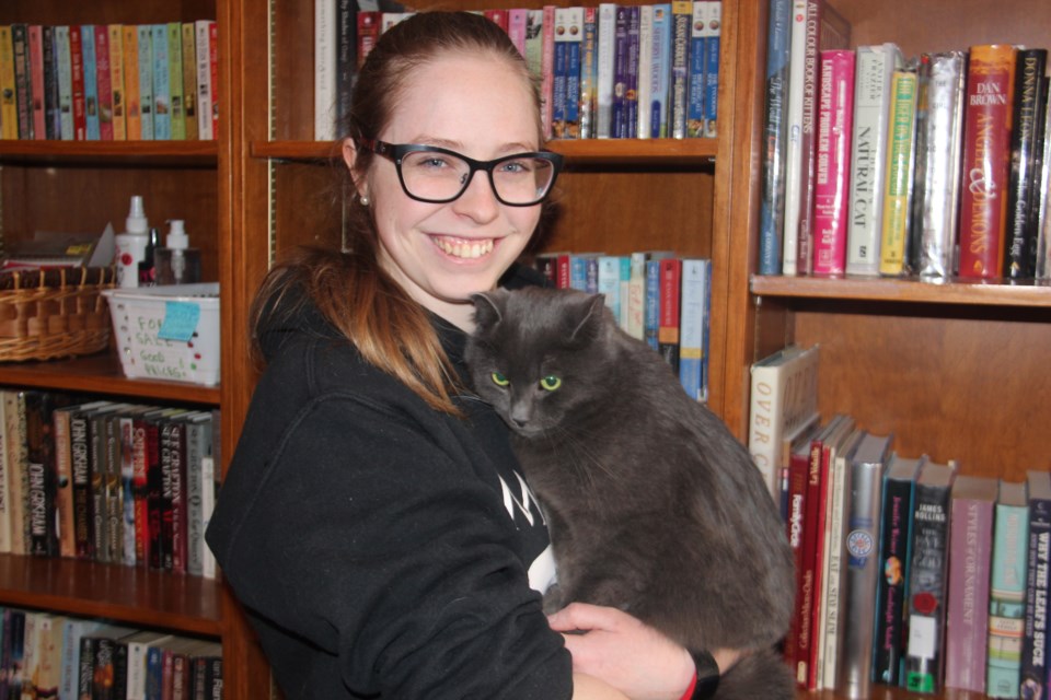 Small Things Cats volunteer Rebecca Rock poses with “Lacosta,” who's since been adopted. (Heidi Ulrichsen/Sudbury.com)