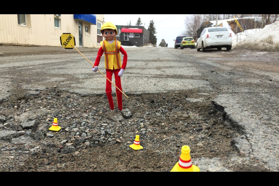Today's Pothole of the Day is on Alder Street. There are far more deadly potholes on Alder than this teeny bump in the road, but this was the safest area for reporter Heather Green-Oliver and intern Annie Duncan to take my close-up photo. (Heather Green-Oliver/Sudbury.com)