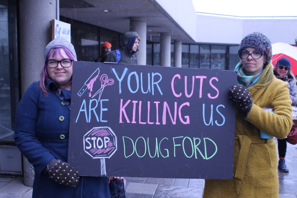 Sew Local owners April Allard (left) and Marja Reimer closed shop to attend today's rallying against spending cuts Premier Doug Ford's government has announced. (Annie Duncan/Sudbury.com)