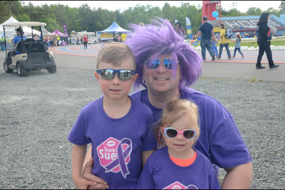 Sam Miller with his kids Marcus (5) and Cassie (2), at the 2019 Relay for Life hosted by Laurentian University. (Marg Seregelyi/ Sudbury.com)