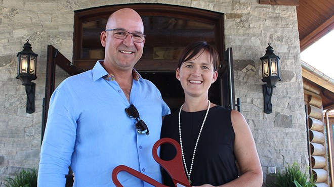 Owner of Killarney Mountain Lodge Holden Rhodes (left) standing with his wife Carey, at the grand opening of the Canada House convention centre (Keira Ferguson/ Sudbury.com)