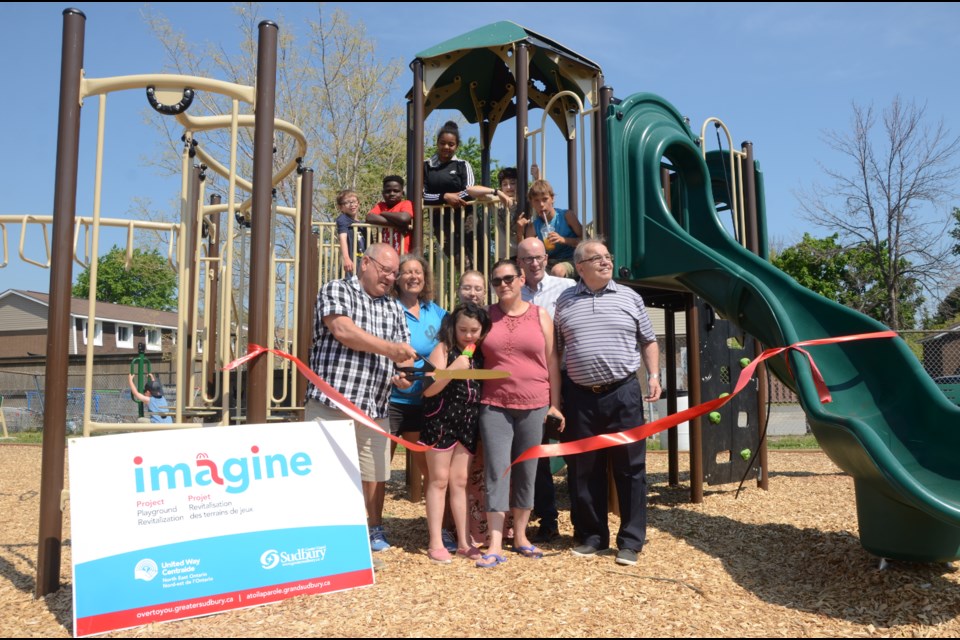 Residents of Place Hurtubise joined in the ribbon cutting ceremony to open their new park. Mayor Brian Bigger, Ward 8 Coun. Al Sizer and United Way executive director Michael Cullen were among the dignitaries. (Arron Pickard/Sudbury.com)
