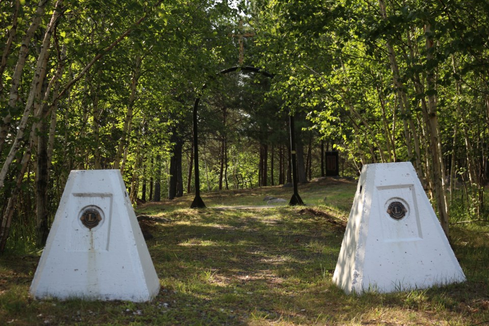 Two, white pillars marking the entrance to the Coniston Cemetery. Donated by the Lions Club in 1997 for the memorial celebration. (Keira Ferguson/ Sudbury.com)