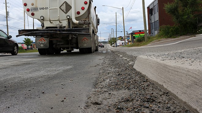 A 10-block section of Lorne Street had to be cleaned up this afternoon after a concrete truck spilled some of its dry load along the roadway. (Keira Ferguson/Sudbury.com)