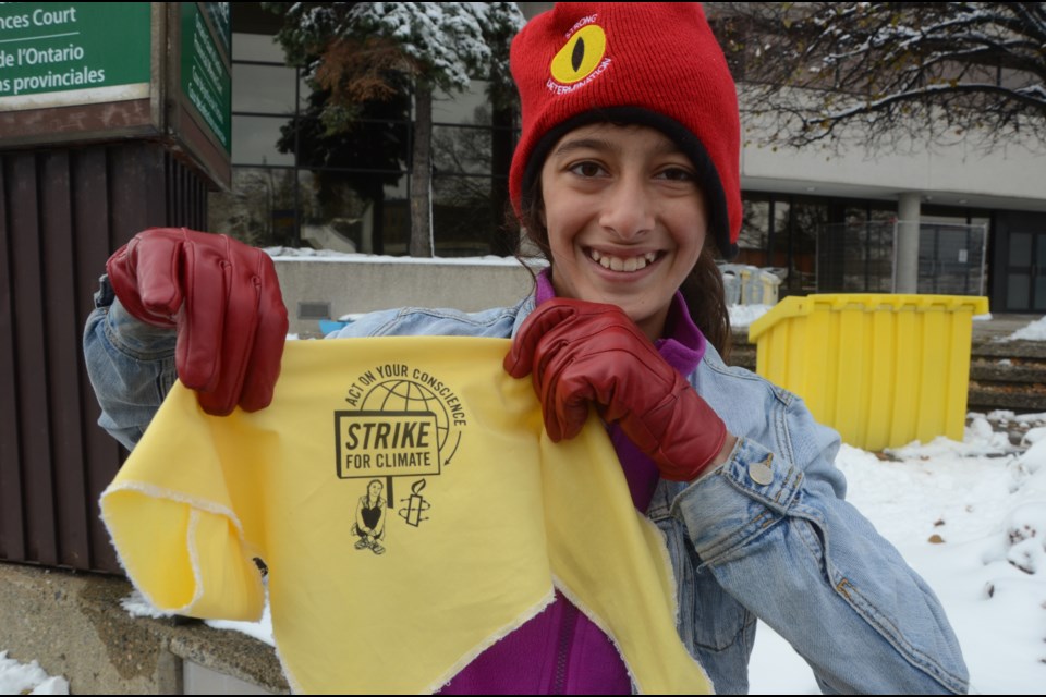 Sophia Mathur presented her supporters with a bandana as a memento of Amnesty International's Ambassador of Conscience Award, presented to Greta Thunberg and the Fridays for Future movement. (Arron Pickard/Sudbury.com)