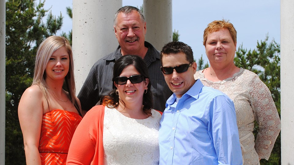 Jessica Robichaud (left) with her brother Erik (right), Erik's wife Rachel and their parents Perry and Elizabeth Robichaud (back). (Supplied).