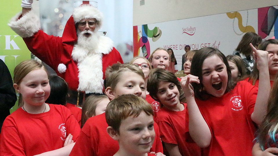 Students from Rainbow District Schools were excited to get a photo with Santa during the kick off of the Edgar Burton Christmas Food Drive and Kids Helping Kids campaign held at the New Sudbury Centre on Nov. 15. (Heather Green-Oliver/Sudbury.com)