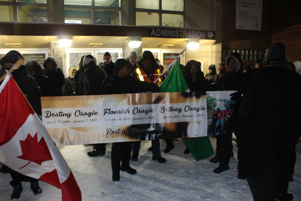 On a bitter cold Sudbury night, dozens gathered in front of the Sudbury Community Arena to support the Osagie family after a New Year's Day tragedy took the lives of their three children. (Matt Durnan/Sudbury.com)