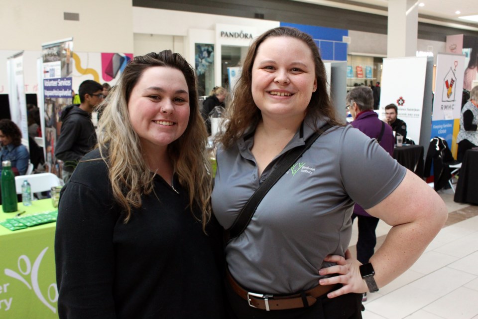 Catt Costello (left), Northern Ontario Families of Children with Cancer administrative assistant and volunteer coordinator and Alanna LaHay, executive director of Volunteer Sudbury/ Bénévolat Sudbury, at the 6th annual Volunteer Fair. (Keira Ferguson/ Sudbury.com)