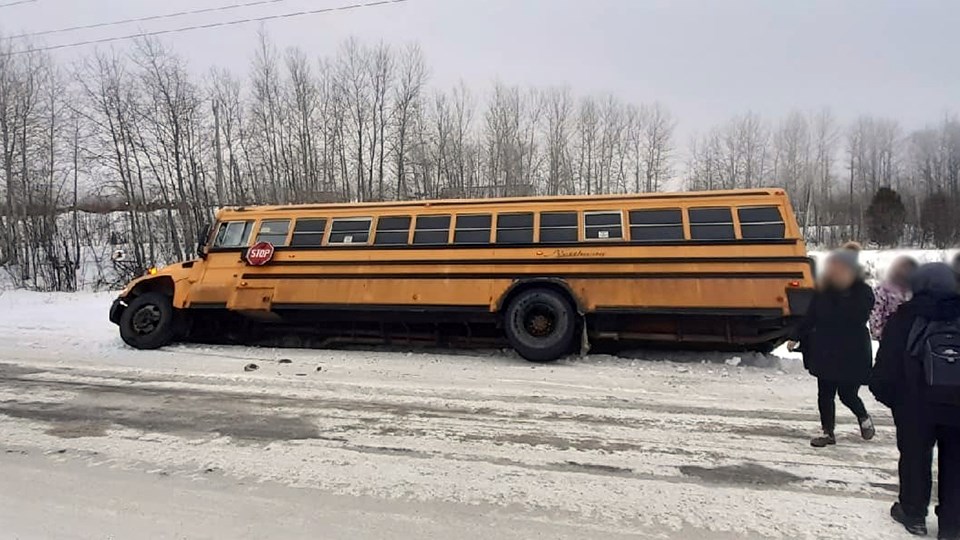 A Northway Bus Lines school bus slipped off the road and into a ditch Monday morning, on its way to drop off a group of students. (Submitted by Kelly Larocque)