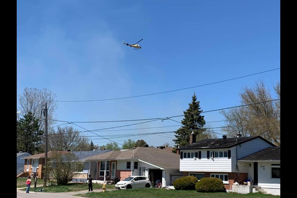 Greater Sudbury Fire Services responded to a bush fire in Capreol, behind C.R. Judd Public School at around 1:40 p.m. Friday. (Capreol Uncensored Facebook)