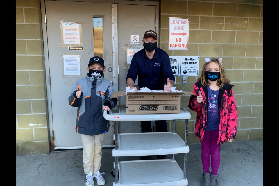 Shawn Scott, owner and operator of Local Jerky Plus, has donated hamburg tubes and boxes of Hamburger Helper to the Blue Door Soup Kitchen to help feed the less fortunate. (Supplied)
