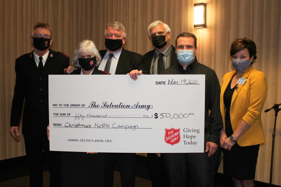 The Lougheed Foundation is matching the first $50,000 brought in by the Salvation Army’s Christmas kettle campaign. From left are Captain Jim VanderHayden, Salvation Army, Captain Deb VanderHayden, Salvation Army, Gerry Lougheed, Jr., Lougheed Foundation, Geoffrey Lougheed, Lougheed Foundation, Trevor Gilchrist, Rotary Club of Sudbury Sunrisers kettle bell chair, Luann Belfry, president Rotary Club of Sudbury Sunrisers. (Heidi Ulrichsen/Sudbury.com)
