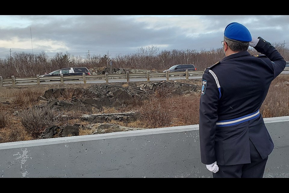 First responders from Greater Sudbury salute the hearse carrying the remains of OPP Const. Marc Hovingh to Manitoulin Island where he will be laid to rest. (Arron Pickard/Sudbury.com)