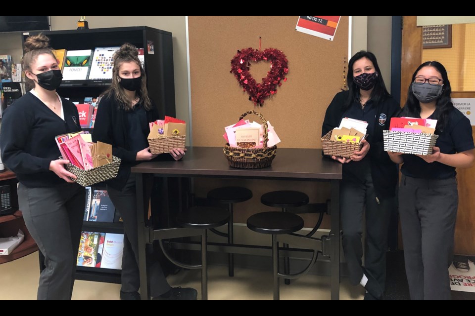 Collège Notre-Dame students with some of the Valentine’s Day cards they created for Extendicare York residents. (Supplied)