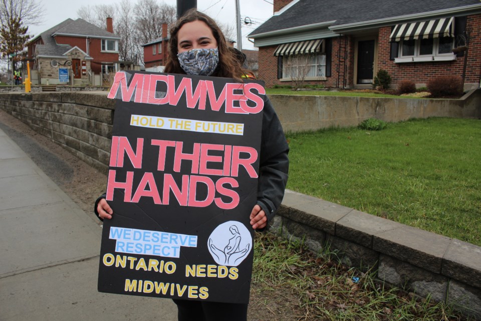 About 100 Sudburians showed their disapproval of the massive cuts to Laurentian University programs and staff in a protest on Paris Street Friday. Ava Carter is finishing her first year in the midwifery program, which has been cut. 