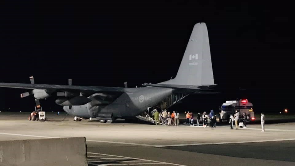 Sudbury's Stef Paquette took these images of the evacuation of Pikangikum First Nation members at the Sudbury Airport Thursday night. 
