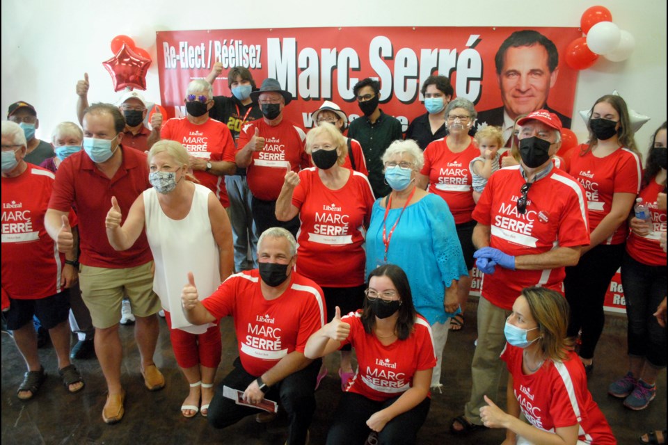 Nickel Belt Liberal incumbent Marc Serré poses for a photo alongside the first round of supporters at the grand opening of his first of two campaign offices on Wednesday, in Val Caron.                      