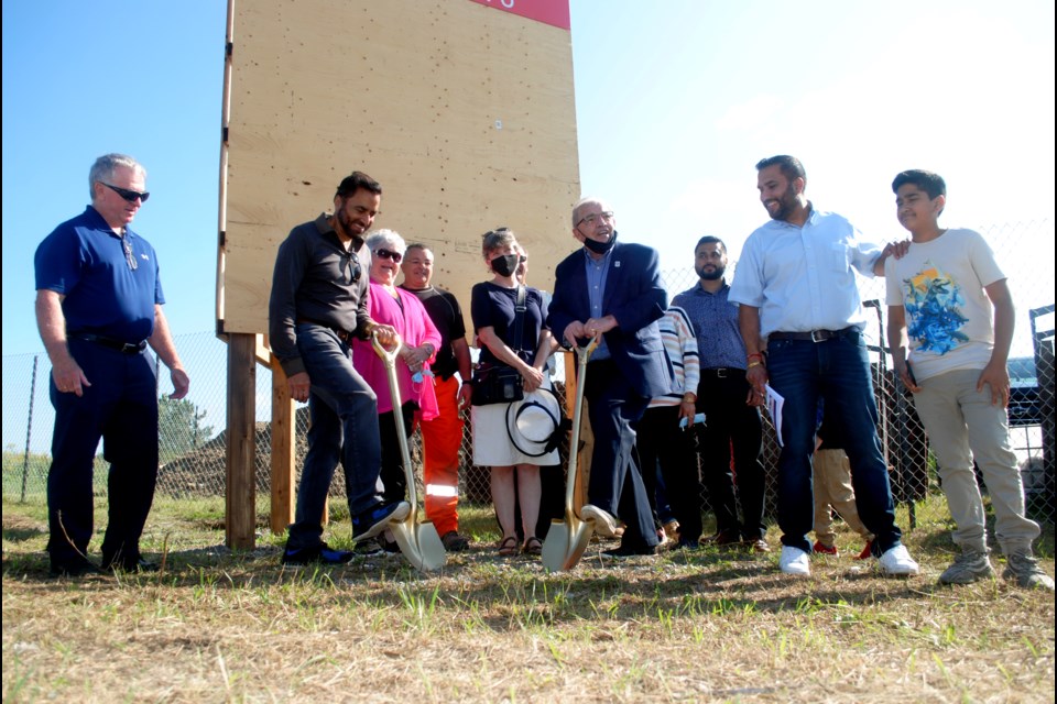 City councillors join stakeholders and developers by gathering around for a groundbreaking ceremony for an assisted living facility on Second Avenue N across the street from the Minnow Lake Dog Park Monday.   