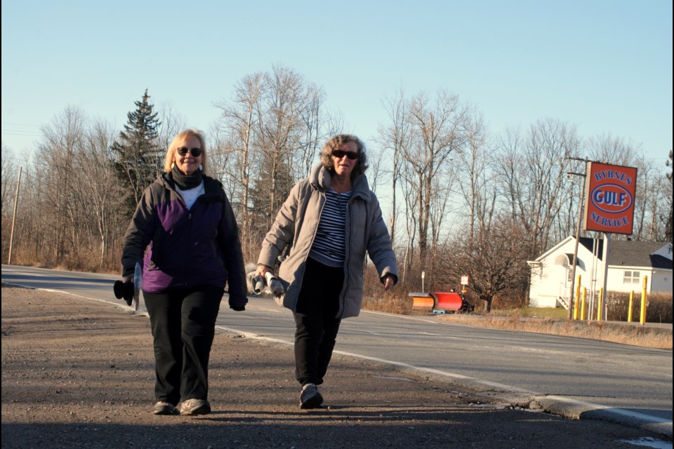 Kim Grenke and Joanne Kinsella walk down Notre Dame Street in Azilda, a stretch of road they join other area residents in saying needs to be made more friendly to pedestrians and cyclists.            