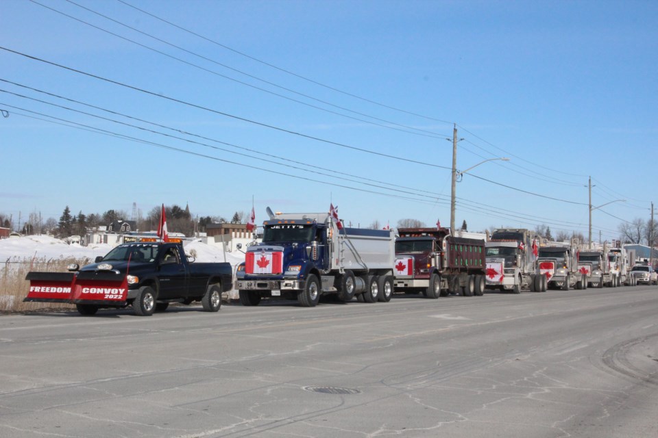 Participants in a Slow Roll Convoy gather along Falconbridge Road Saturday, Feb. 5, 2022.