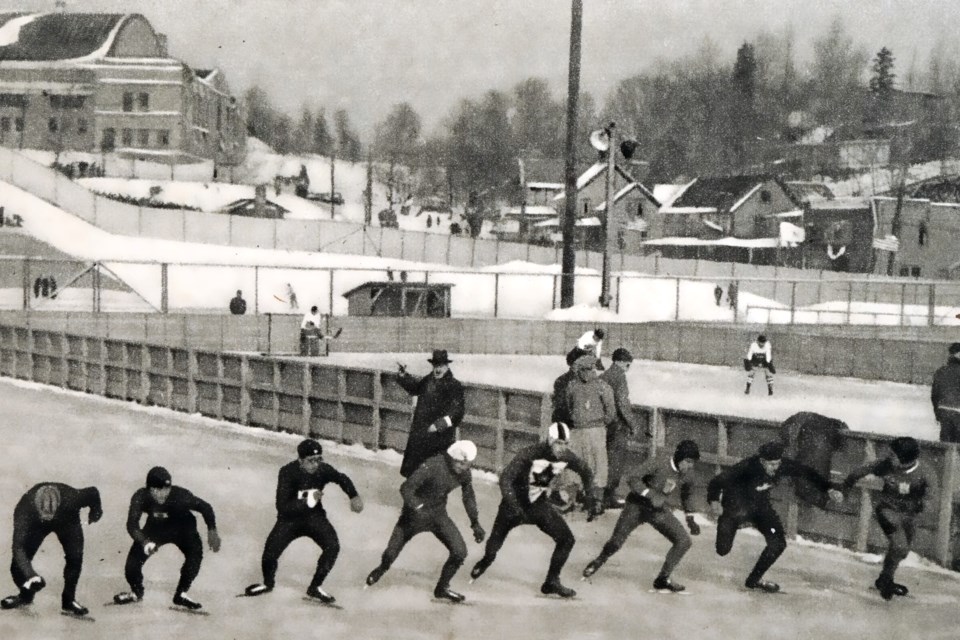 Godfrey Dewey, president of the 1932 Olympic organizing committee, awards the silver medal for the 1500-metre speed skating event to Canadian Alexander Hurd (left), the gold medal to American Jack Shea (centre), and the bronze medal to Canadian William Logan, 1932. 