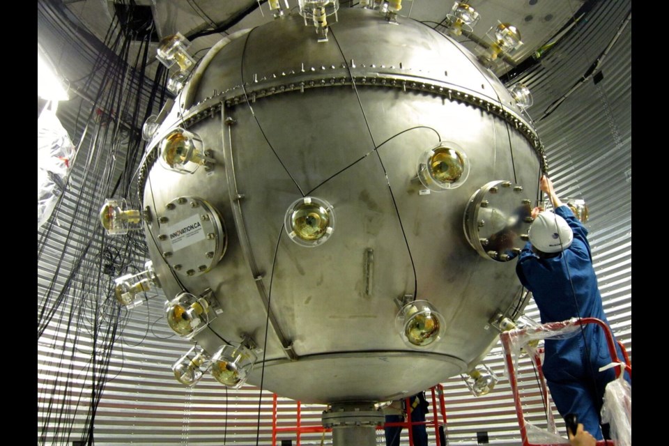 Construction of the DEAP-3600 dark matter experiment is seen under construction.