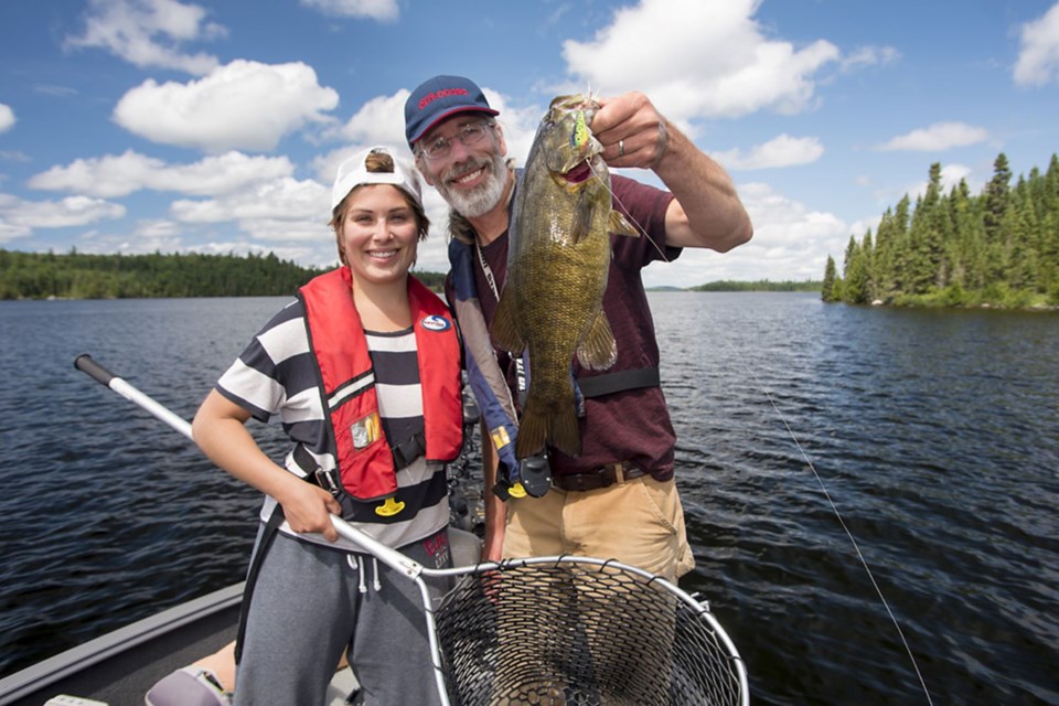 Expert fisher James Smedley fishing with his daughter Islay Smedley. (Photo Supplied)
