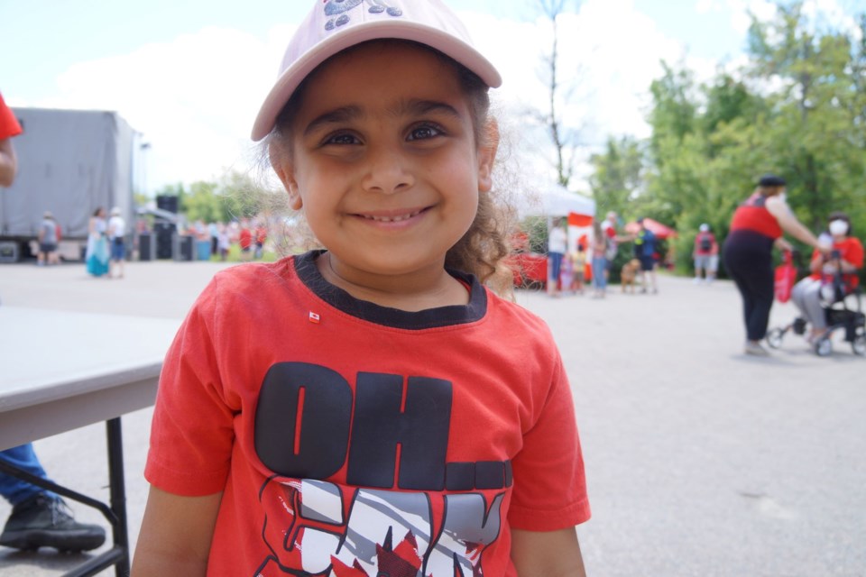 Olivia Gergis, 5, is thrilled to be at the Canada Festivities and delighted to pose for a picture. 