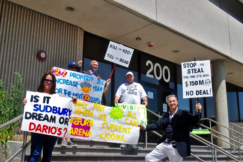 Some of today’s anti-Kingsway Entertainment District protesters are seen gathered outside of Tom Davies Square with signs opposing the project. The signs were not allowed in the building.