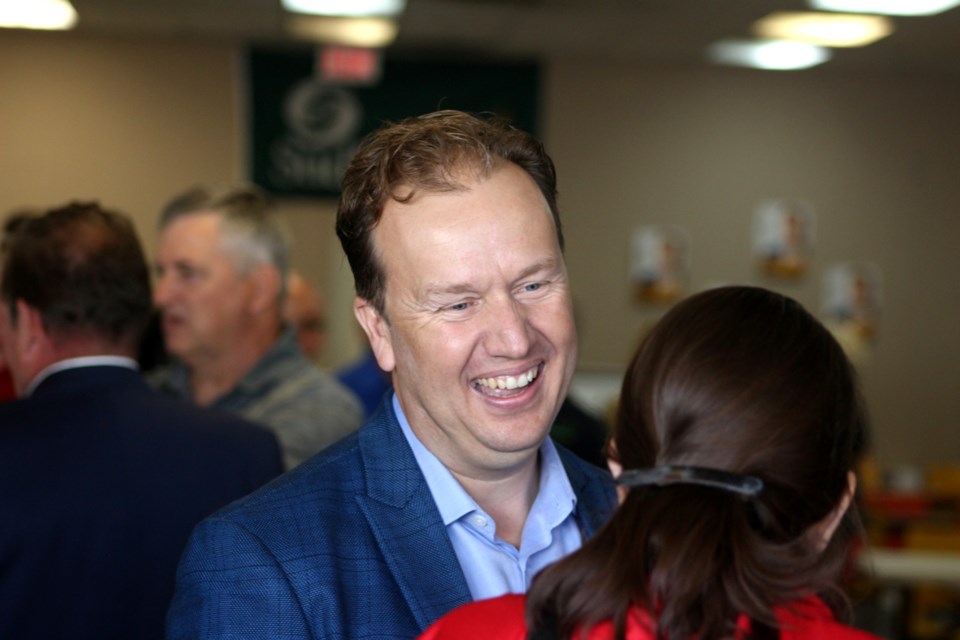 Greater Sudbury mayoral candidate Paul Lefebvre mingles with supporters during the grand opening of his campaign office this morning. 