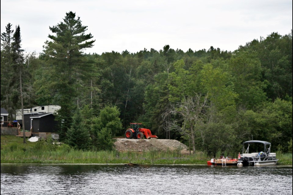Heavy machinery is seen parked at Camp Maple Mountain, at the north edge of Skill Lake. Area residents are concerned about the land’s development to accommodate 100 campsites. 
