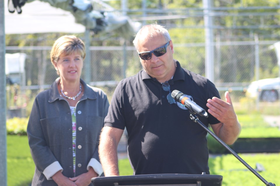 Northern Ontario Farm Innovation Alliance president Yves Gauthier speaks as Agriculture and Agri-Food Minister Marie-Claude Bibeau looks on.
