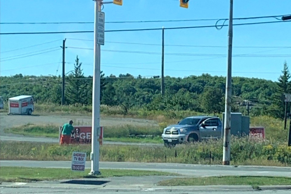 Someone is seen vandalizing Mayor Brian Bigger’s campaign signs with black spray paint in Lively at approximately 4 p.m. on Aug. 26. 