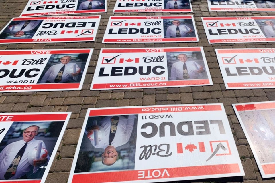 Ward 11 Coun. Bill Leduc’s re-election campaign signs are seen, which advertise his campaign website, BillLeduc.ca, which now links to the campaign website of his political opponent, Christopher Duncanson-Hales.