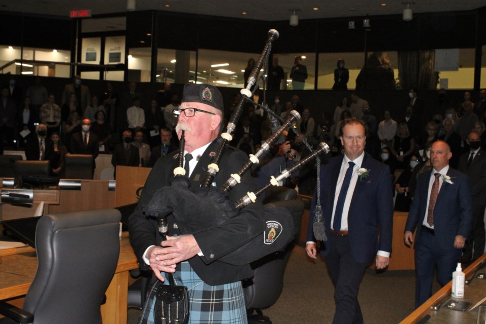 Pipe major David Linney of the Greater Sudbury Police Band ushers in the new city council during their inaugural ceremony at Tom Davies Square on Thursday night.
