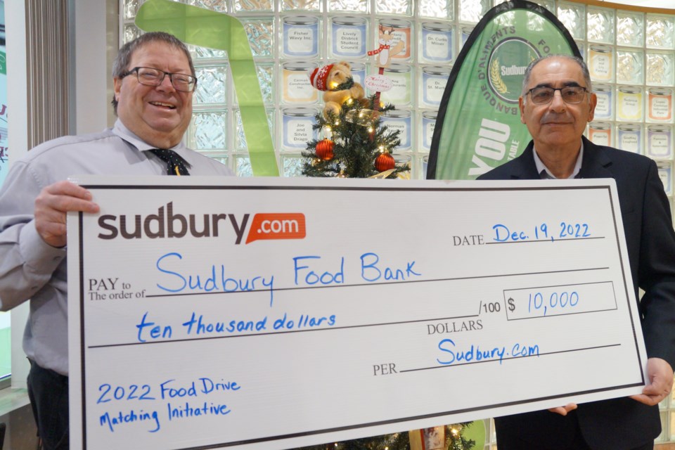 Sudbury.com Publisher Abbas Homayed with Dan Xilon, the Executive Director of the Sudbury Food Bank.                             
