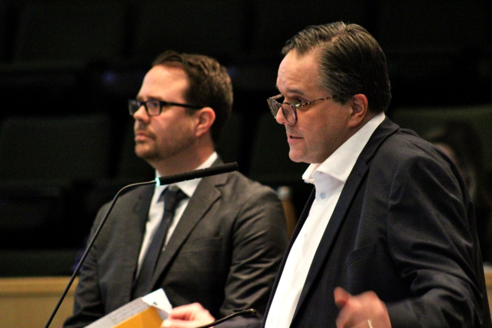 Greater Sudbury Public Library chairperson Michael Bellmore speaks while library CEO Brian Harding looks on during Tuesday’s finance and administration committee meeting at city hall.