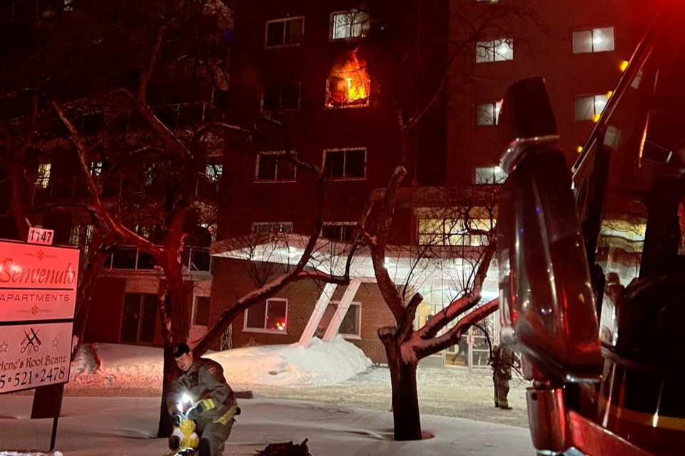 Flames are seen from an apartment at the Benvenuto Apartment building on Jan. 28 (Greater Sudbury Fire Fighters Facebook)